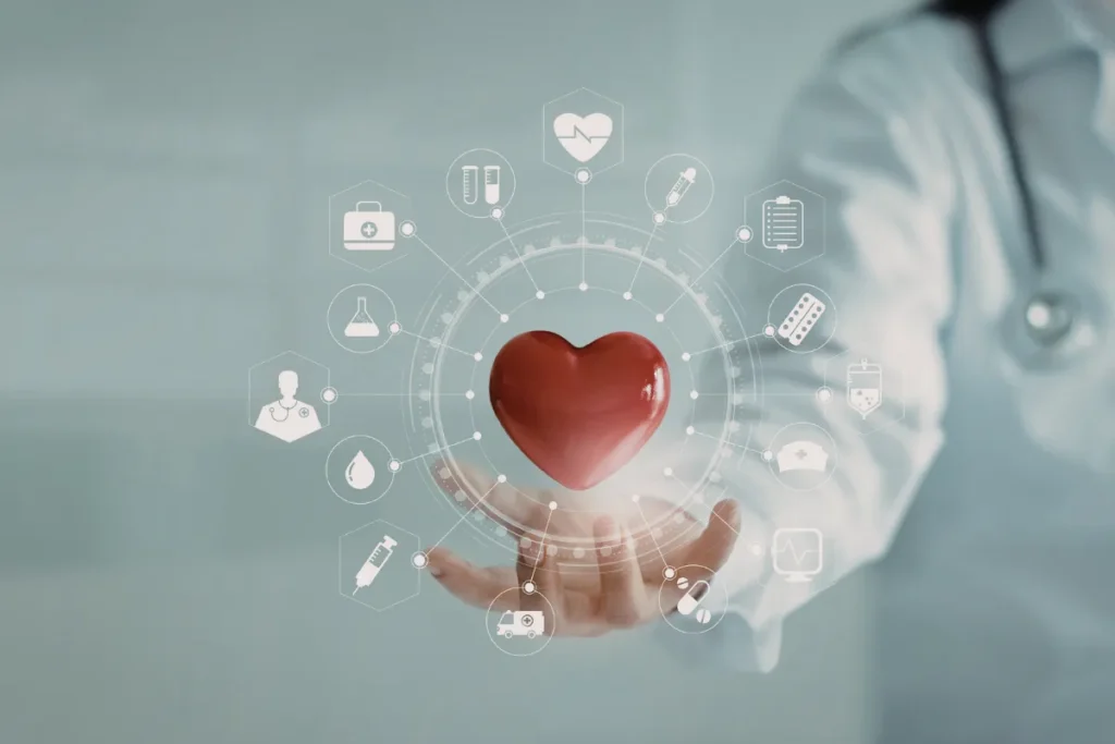 Profissional de saúde segurando um coração simbólico com ícones médicos digitais ao redor.